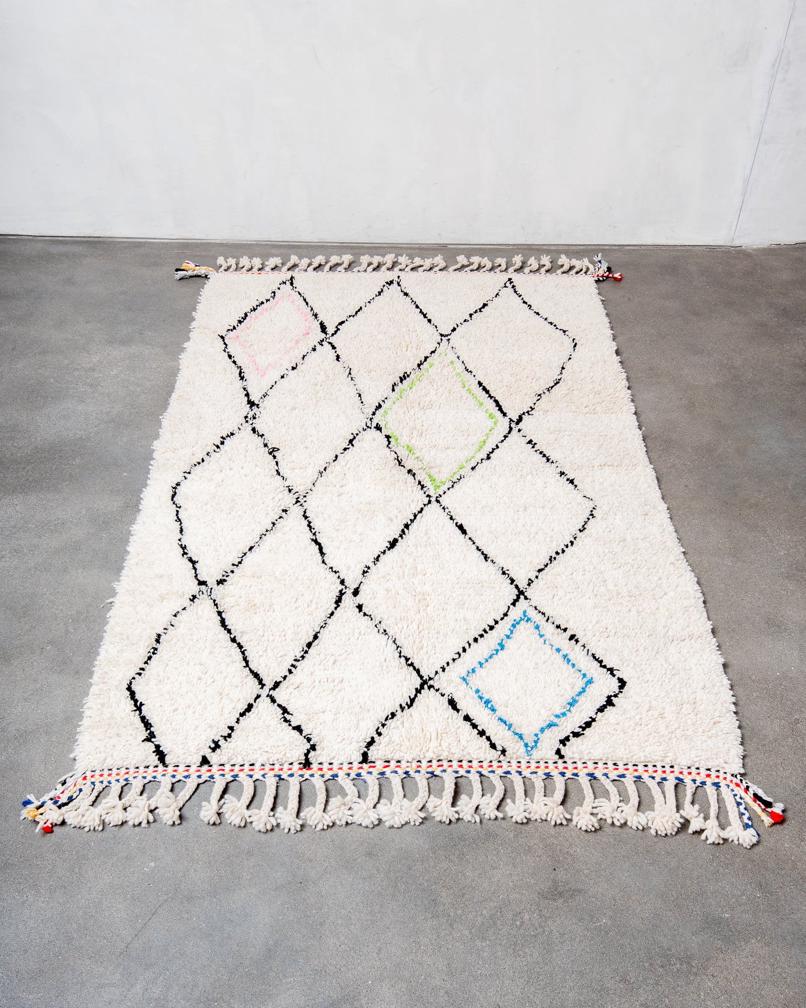 Modern, designer, handcrafted Berber rug from Morocco. Beniourain carpet with beautiful colours and patterns and fluffy wool texture.
